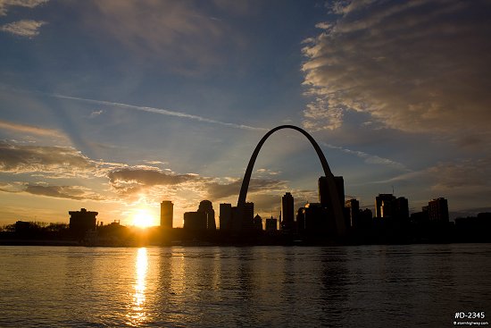 Golden setting sun behind downtown