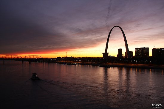 Vivid, deep sunset colors with tugboat