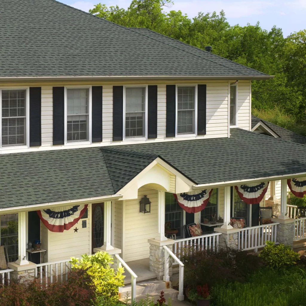 House with Hunter Green Shingles - GAF Timberline HDZ Shingles