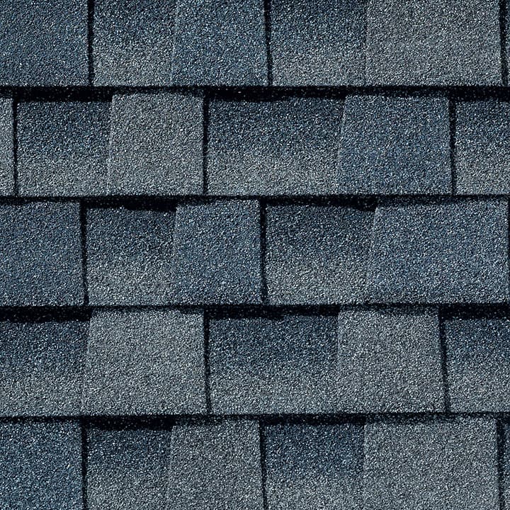 Timberline HD Biscayne Blue shingle swatch from GAF, a top roofing manufacturer, featuring a deep, rich blue color and distinctive texture that makes a bold statement.