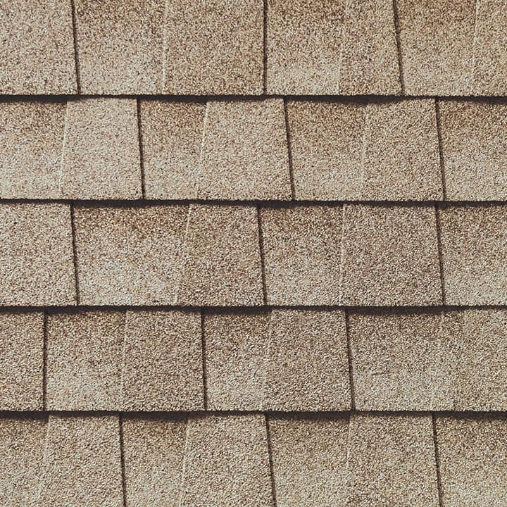 Timberline HD Golden Amber shingle swatch from GAF, a top roofing manufacturer, featuring warm, golden tones and a distinctive texture that adds character and durability to any home.