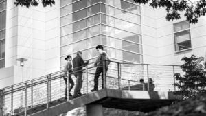 three students walk upstairs to Duffield Hall