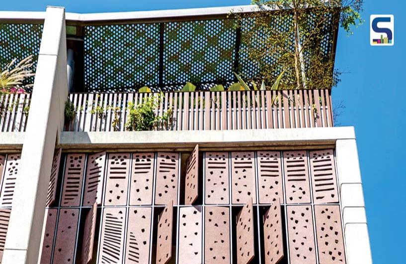 Perforated Facade with Red Granite Kinetic Screen | Dipen Gada & Associates