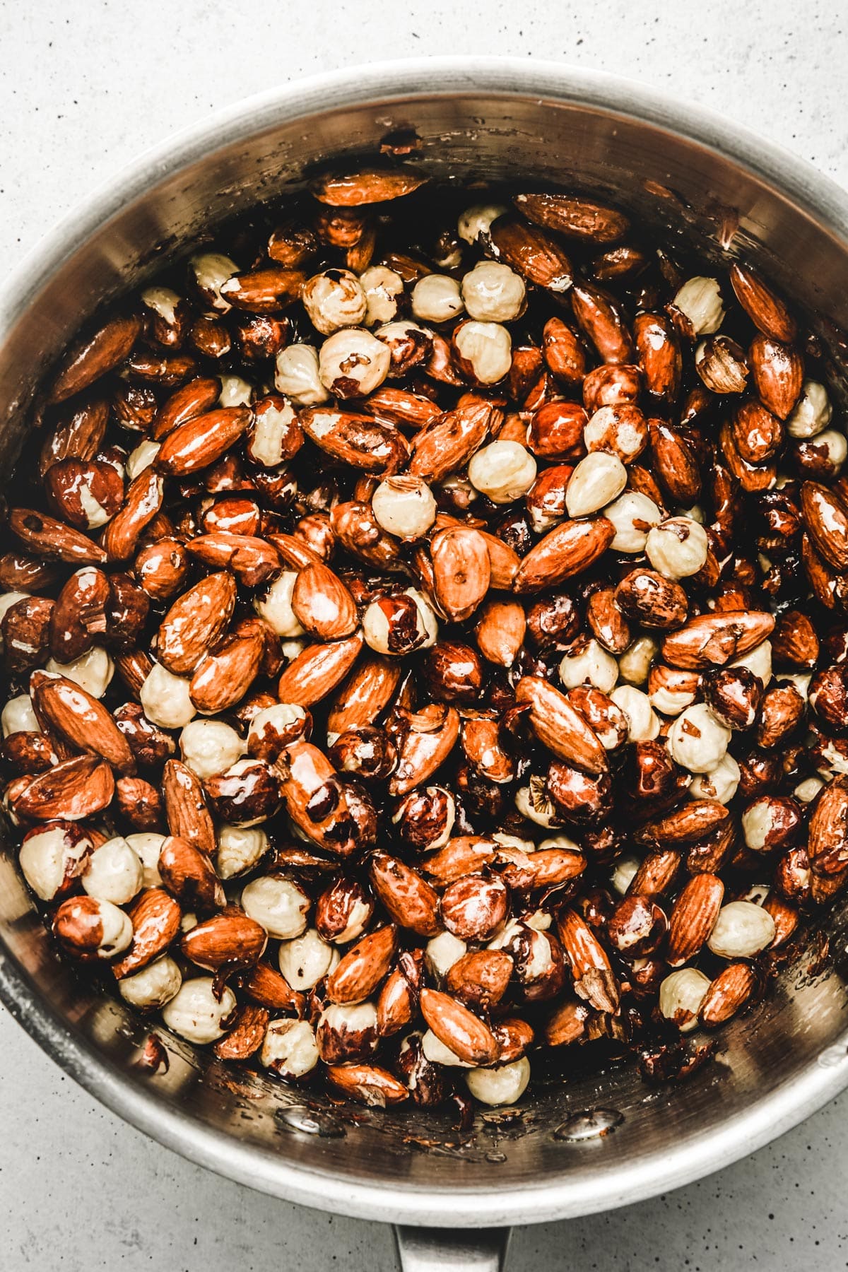 Almond and hazelnut on a saucepan