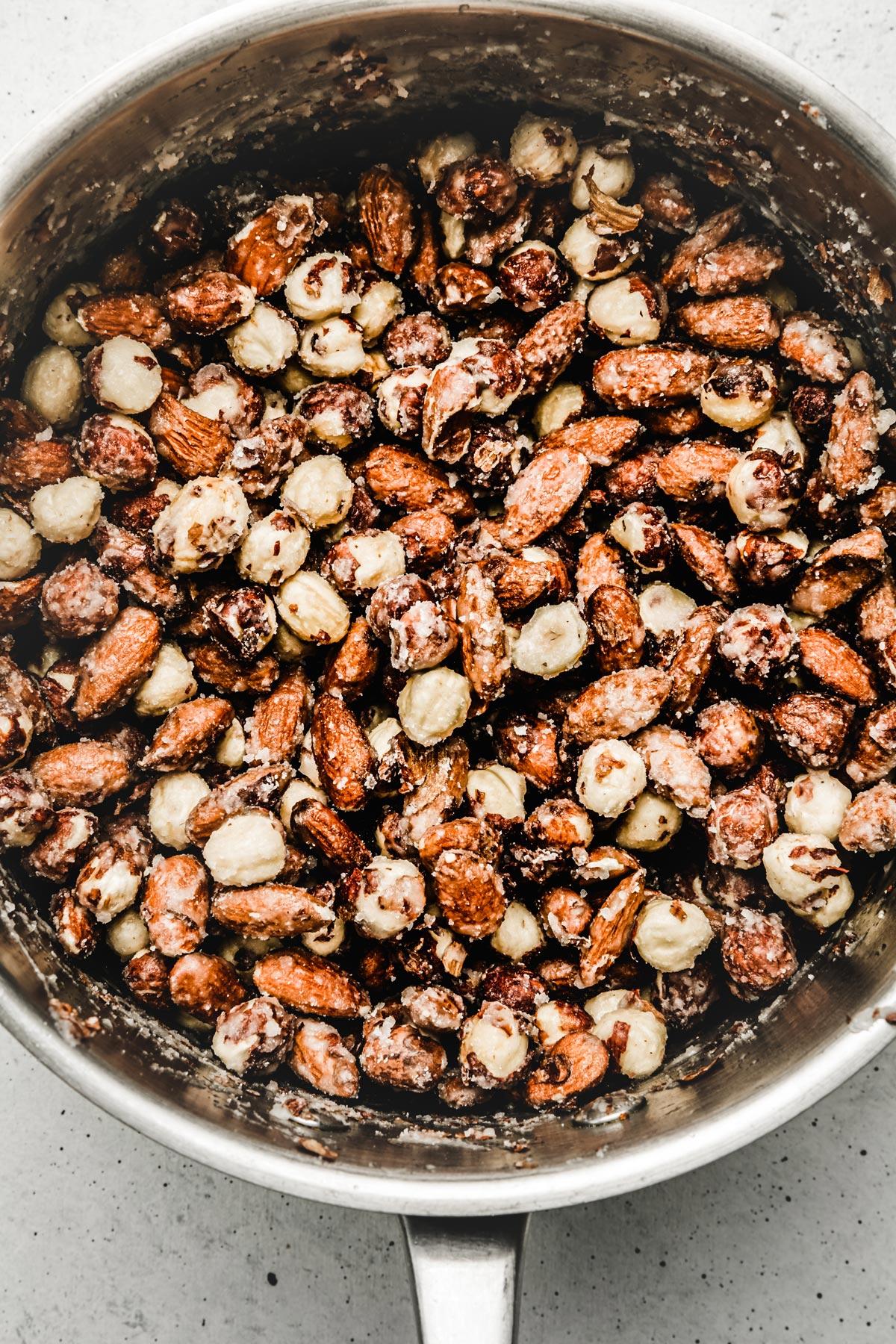 saucepan with with sugar coated hazelnut and almonds