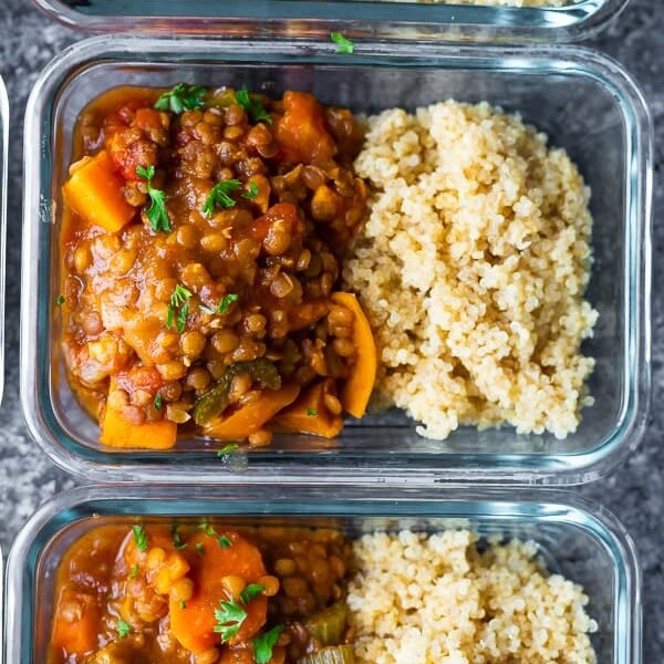 overhead shot of glass meal prep container filled with moroccan instant pot lentils and rice