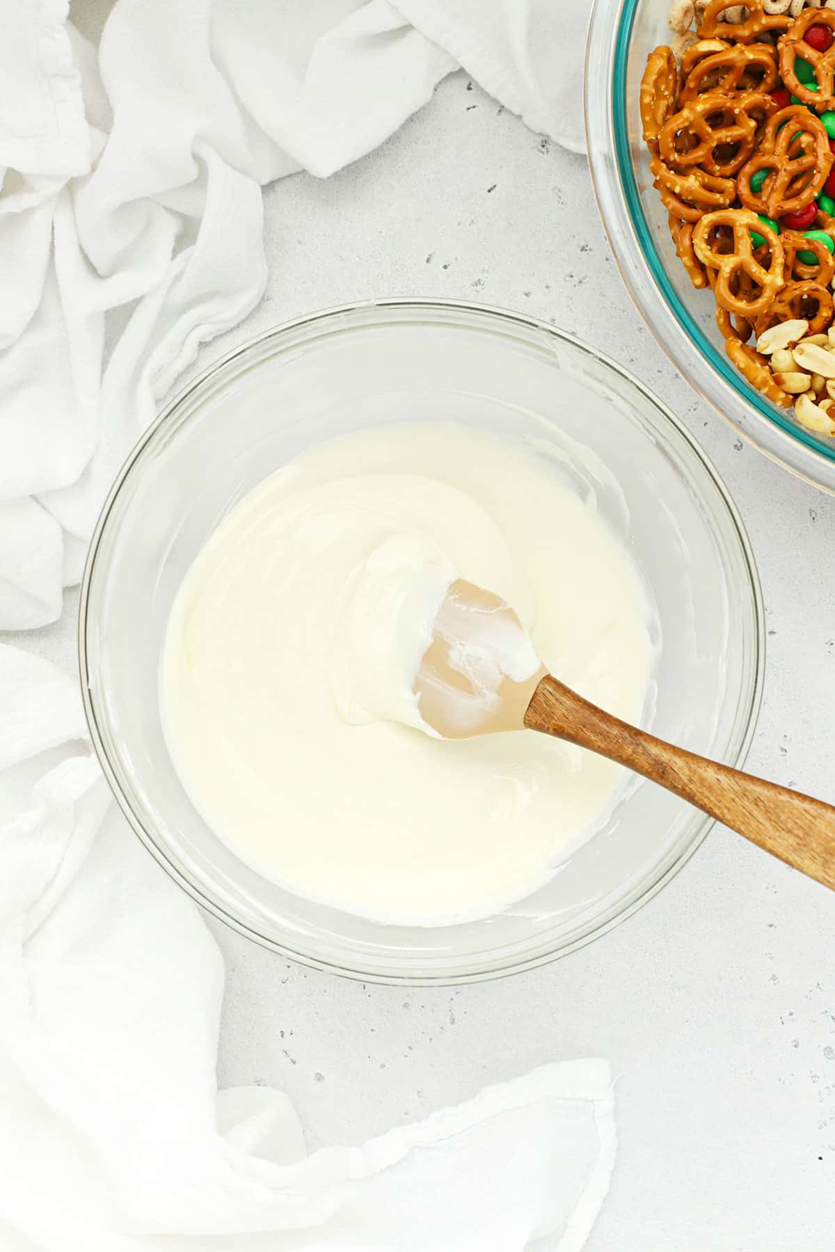 Melted vanilla almond bark in a glass bowl