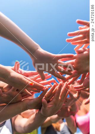 Group of women putting their beauty hands together 24720186