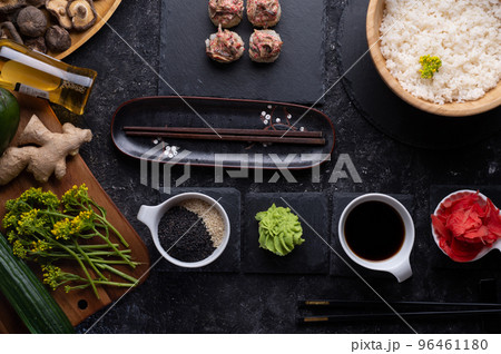 sushi roll set with shiitake mushrooms with rice served  at gblack dish at black table. flat lay 96461180