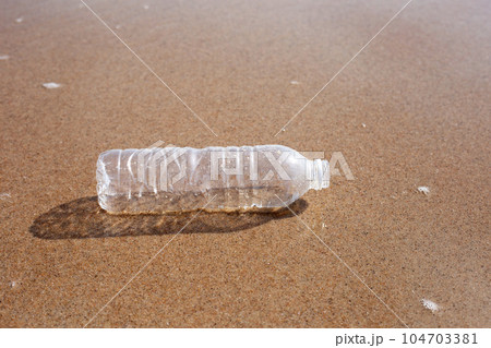 Plastic bottle on the beach 104703381