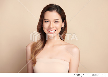 Beautiful smile of young asian woman with healthy white teeth on beige background, Dental care. Dentistry concept. 110068069