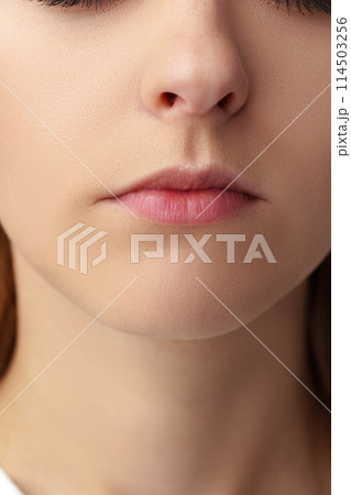 Close up of a young woman with nude make up 114503256