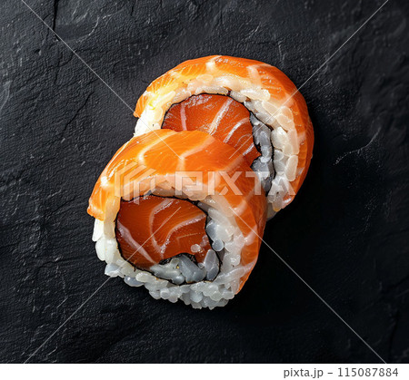 Sushi set with wasabi and ginger on black stone tray on black table. Top view. 115087884