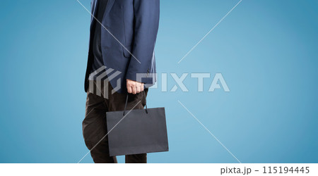 Modern male shopper with stylish bag 115194445