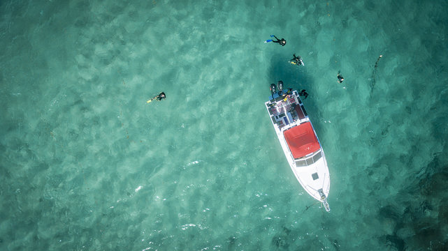 Aerial view of Orient Bay Beach with diving boat, Saint Martin Beaches in Caribbean