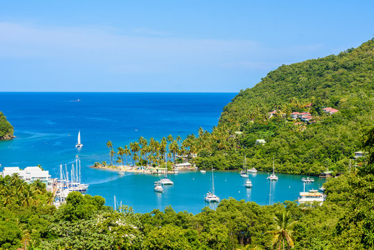 Marigot Bay, Saint Lucia, Caribbean. Tropical bay and beach in exotic and paradise landscape scenery. Marigot Bay is located on the west coast of the Caribbean island of St Lucia.