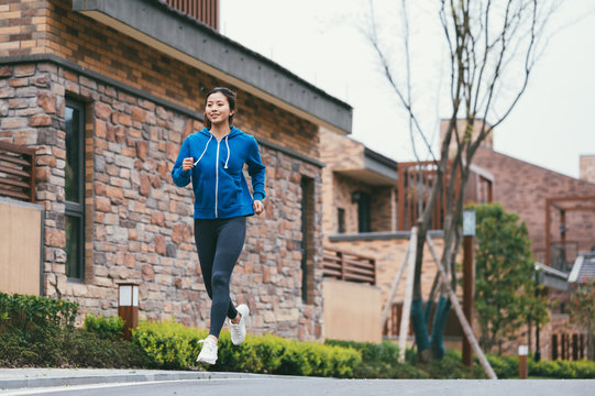 young asian beauty woman running outdoors