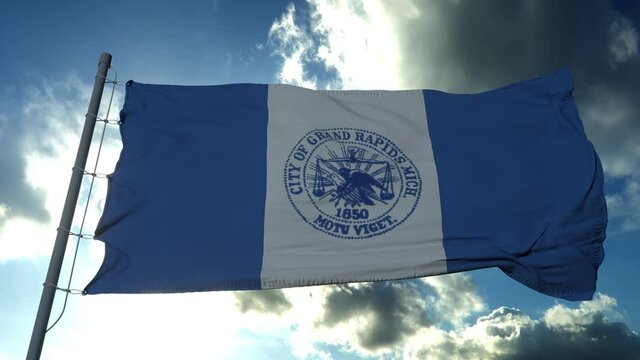 Flag of Grand Rapids city, city of Michigan, United States of America, waving at wind in blue sky