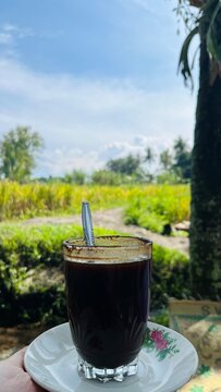 cup of coffee on the rice field, Kopi klotok