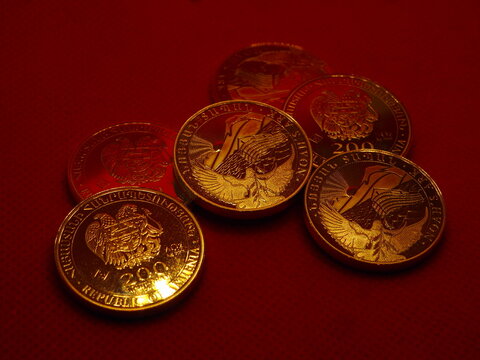 Silver half-ounce bullion coin from Armenia, Noah's Ark. Shiny silver bullion coins on a red background