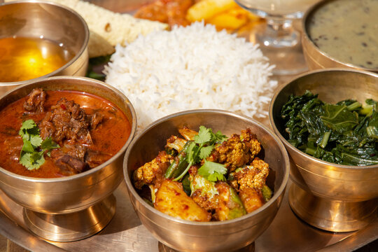 Nepali Meal of Daal Bhaat Tarkari Thakali Thali  Meat Rice vegetables and pickle dhido meal dinner or lunch