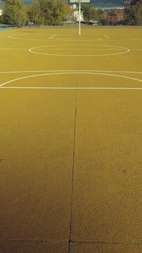 Damaged basketball hoop on outdoor court montage