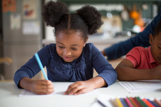 African American girl doing school work at home