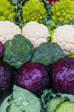 fresh vegetables in the market. Variety of cabbages: broccoli, cauliflower and romanescu