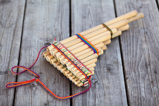 Pan flute (panpipes or syrinx) a musical instrument lying on square-edged flooring