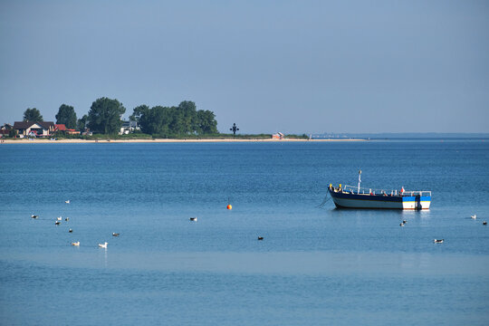 Sigle boat and Rewa Peninsula in the background, Poland