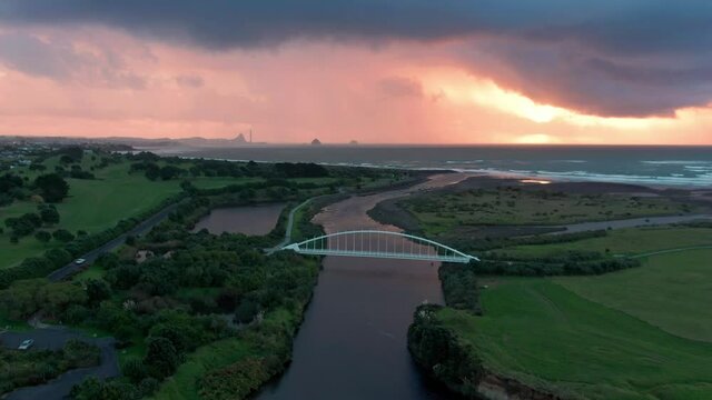 Aerial: Te Rewa Rewa Bridge at sunset, New Plymouth, Taranaki, New Zealand