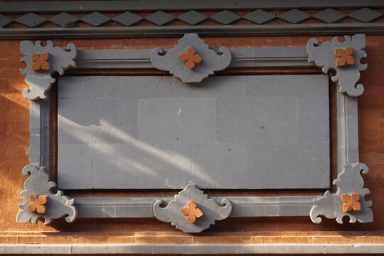 Carved wall of a house in a village in Bali.