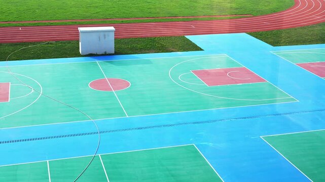 School sport field with basketball court and track