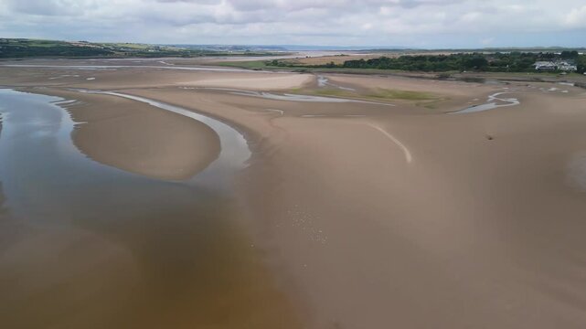 Aerial over the River Taw Estuary at low tide looking towards Fremington, Appledore and Westward Ho