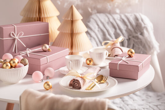 Stunning Christmas tableware for two with tableware full of presents.