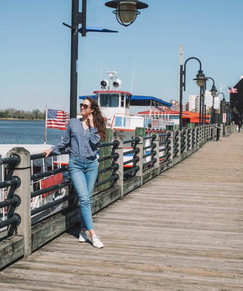 Woman posing on Wilmington River Walk on a sunny day.