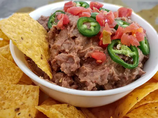 Spice refried beans up with jalapenos hot sauce cayenne pepper