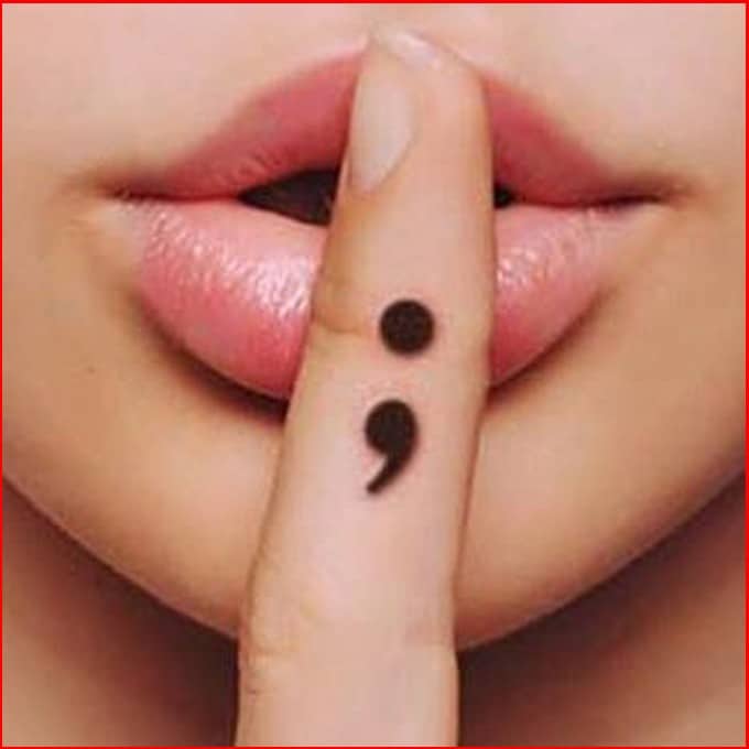 semicolon tattoo on finger