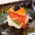 A super reward wrap of medium fatty tuna, salted sea urchin, salmon roe and caviar