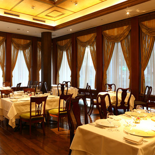 An elegant Art Deco-style dining space with sparkling, delicate stained glass