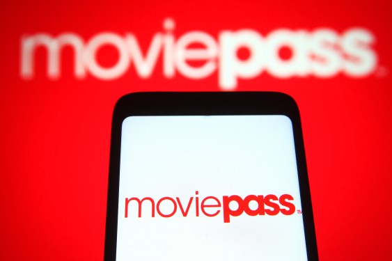 In this photo illustration, a MoviePass Inc. logo is seen on a smartphone and a pc screen.