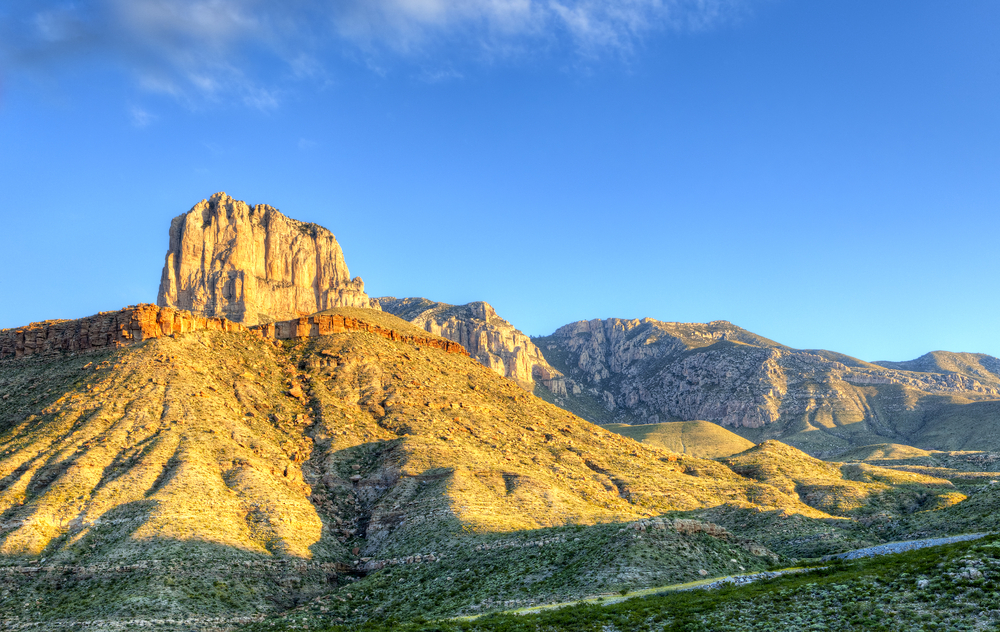 a rocky mountain desert landscape at sunset