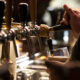 closeup of someone pouring beer from tap in glass best breweries in san antonio