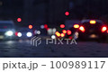 Bokeh of street evening lights, night city with car lights. 100989117