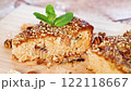 Sponge cake with prunes and nuts on wood 122118667