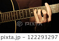 Guitar Player's Hands Showing Chord Progression On Acoustic Guitar 122293297