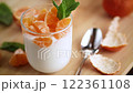 Light fruit dessert with tangerines and mint 122361108