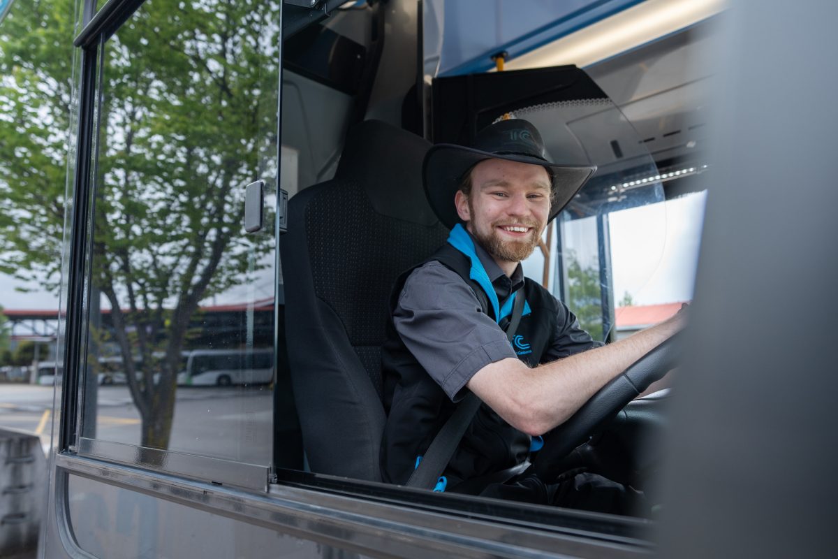 Brock Ginman driving a bus