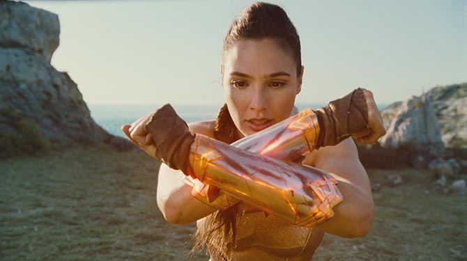 The first time Wonder Woman realizes that when she clashes her bracelets together they produce a concussive forcefield around her. Photo Warner Brothers