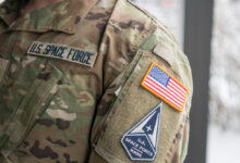 Space Force Staff Sgt. David Diehl II, 436th Communications Squadron noncommissioned officer in charge of wing cybersecurity, displays his new uniform Space Force tapes and service branch patch at Dover Air Force Base, Del., Feb. 12, 2021.